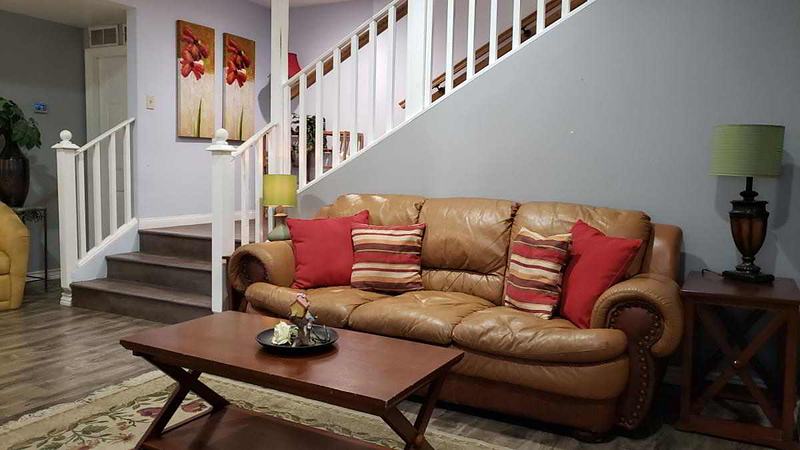 Entry area livingroom with staircase behind.
