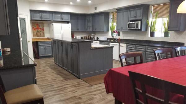 large kitchen filming location with large center island, graite countertops<